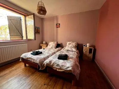 Un ou plusieurs lits dans un hébergement de l'établissement Gîte de la petite Reine