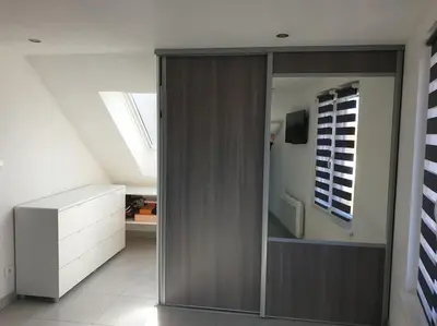 Télévision ou salle de divertissement dans l'établissement Gîte l'Oiseau du Paradis - Appartement moderne au cœur de l'Alsace