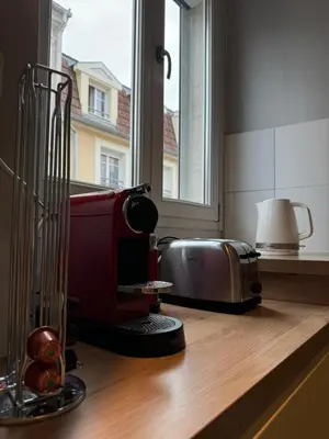 Cuisine ou kitchenette dans l'établissement Les 6 Cordiers au coeur de ville