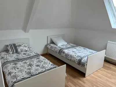 Un ou plusieurs lits dans un hébergement de l'établissement Très belle maison