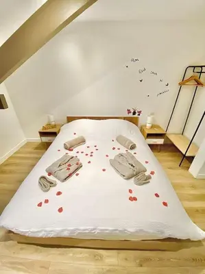 Un ou plusieurs lits dans un hébergement de l'établissement L appartement du Fayé