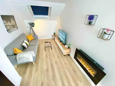 Télévision ou salle de divertissement dans l'établissement L appartement du Fayé