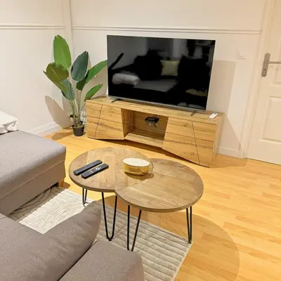 Télévision ou salle de divertissement dans l'établissement Au Soleil - Appartement confortable