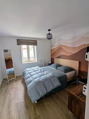 Un ou plusieurs lits dans un hébergement de l'établissement Le grenier du Rempart, appartement au coeur du village