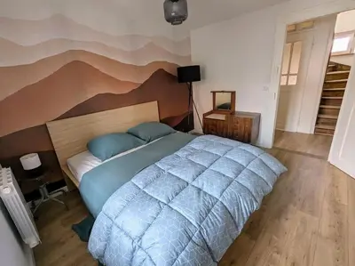 Un ou plusieurs lits dans un hébergement de l'établissement Le grenier du Rempart, appartement au coeur du village