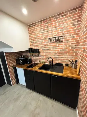 Cuisine ou kitchenette dans l'établissement L'Atelier du Désir - Centre - Proche Gare