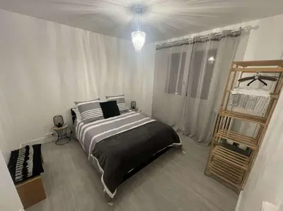 Un ou plusieurs lits dans un hébergement de l'établissement Confort & Style au Cœur de Mulhouse