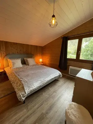 Un ou plusieurs lits dans un hébergement de l'établissement Chalet Le Clefcy - Vosges - Spa - Proche Gérardmer