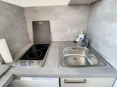 Cuisine ou kitchenette dans l'établissement Studio 8 - proche tram, Bâle, autoroute