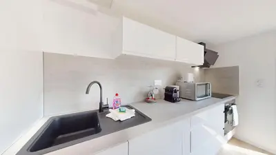 Cuisine ou kitchenette dans l'établissement Nid de la Luss