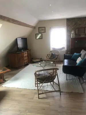 Télévision ou salle de divertissement dans l'établissement Le duplex de l ancienne forge