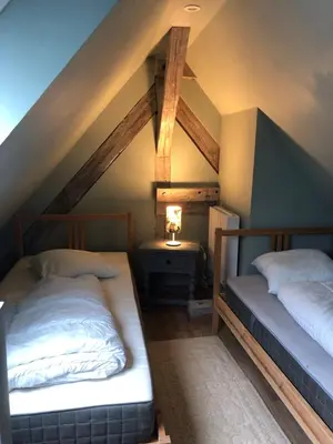 Un ou plusieurs lits dans un hébergement de l'établissement Le duplex de l ancienne forge