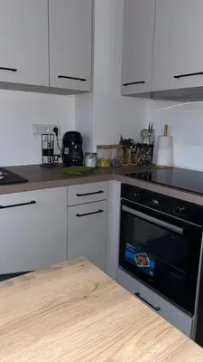 Cuisine ou kitchenette dans l'établissement Le sept