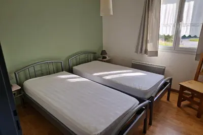 Un ou plusieurs lits dans un hébergement de l'établissement Appartement avec vue sur le lac de Gérardmer, proche des pistes de ski