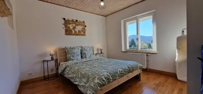 Un ou plusieurs lits dans un hébergement de l'établissement La Maison des Montagnes