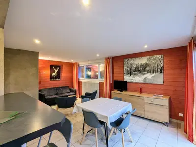 Coin salon dans l'établissement Gîte cosy au cœur de Gérardmer avec jardin et terrasse - FR-1-589-670