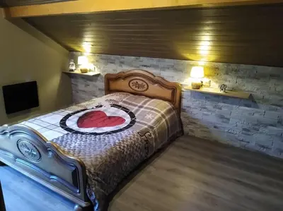 Un ou plusieurs lits dans un hébergement de l'établissement Superbe chalet Hautes Vosges