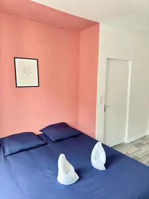 Un ou plusieurs lits dans un hébergement de l'établissement Cosy 1 - Montbéliard centre 80m2