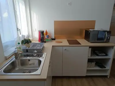 Cuisine ou kitchenette dans l'établissement La Pause