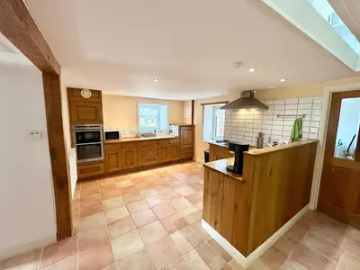 Cuisine ou kitchenette dans l'établissement Chalet des roches - Plainfaing