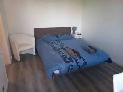 Un ou plusieurs lits dans un hébergement de l'établissement Studio 76 - Balcon, proche Bâle