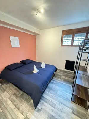 Un ou plusieurs lits dans un hébergement de l'établissement Cosy 2 - Montbéliard centre 80m2