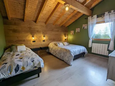 Un ou plusieurs lits dans un hébergement de l'établissement Chalet cosy avec sauna et spa dans le Massif des Vosges - FR-1-589-672