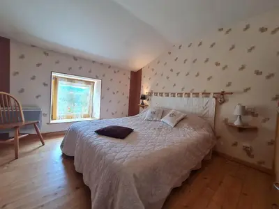 Un ou plusieurs lits dans un hébergement de l'établissement Gîte confortable près de Gérardmer avec terrasse et accueil chaleureux - FR-1-589-676