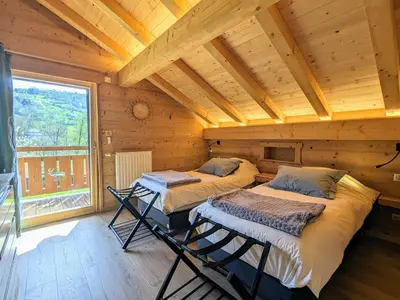 Un ou plusieurs lits dans un hébergement de l'établissement Chalet au cœur des Vosges avec sauna, terrasse et connexion WIFI - FR-1-589-692