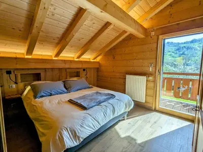 Un ou plusieurs lits dans un hébergement de l'établissement Chalet au cœur des Vosges avec sauna, terrasse et connexion WIFI - FR-1-589-692