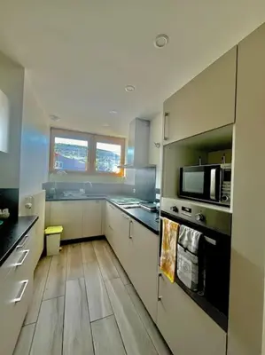 Cuisine ou kitchenette dans l'établissement Gîte du tétras
