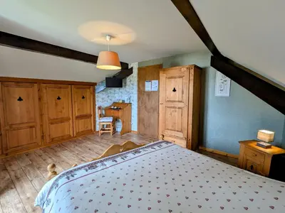 Un ou plusieurs lits dans un hébergement de l'établissement Chambre familiale avec piscine et SPA à Anould - FR-1-589-708