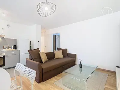 Coin salon dans l'établissement Appartement de charme neuf