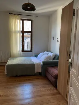 Un ou plusieurs lits dans un hébergement de l'établissement Appartement de style 70