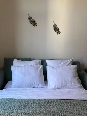 Un ou plusieurs lits dans un hébergement de l'établissement Appartement de style 70