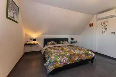 Un ou plusieurs lits dans un hébergement de l'établissement Gîte au Cœur des champs chez Sandrine et Manu