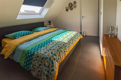 Un ou plusieurs lits dans un hébergement de l'établissement Gîte au Cœur des champs chez Sandrine et Manu