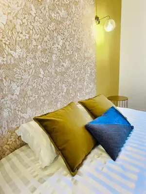 Un ou plusieurs lits dans un hébergement de l'établissement 202 - Chaleureux appartement proche centre ville