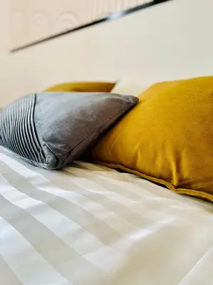 Un ou plusieurs lits dans un hébergement de l'établissement 101 - Appartement élégant art déco près du centre ville