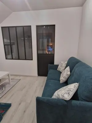 Coin salon dans l'établissement Appartement Au petit bonheur