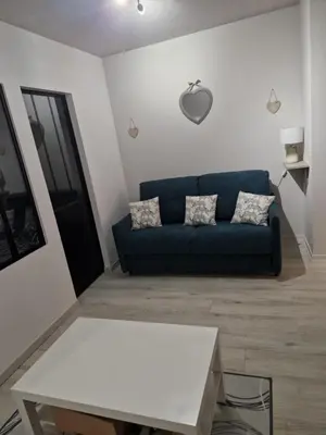 Coin salon dans l'établissement Appartement Au petit bonheur