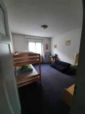 Un ou plusieurs lits dans un hébergement de l'établissement F6 2e étage 4 chambres Gerardmer Centre