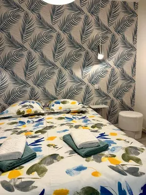 Un ou plusieurs lits dans un hébergement de l'établissement Le Duplex du Parc - Terrasse
