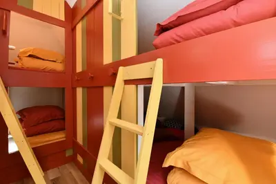 Un ou plusieurs lits dans un hébergement de l'établissement Au Paradis des 4 Saisons - Maison avec terrasse - Baignoire Balneo