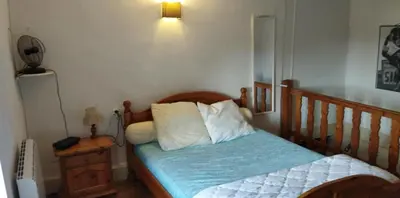 Un ou plusieurs lits dans un hébergement de l'établissement Appartement F2