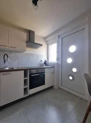 Cuisine ou kitchenette dans l'établissement Top appart V9