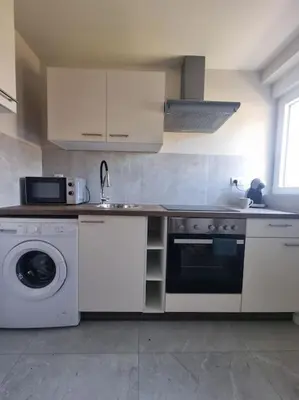 Cuisine ou kitchenette dans l'établissement Top appart V9