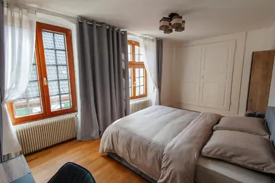 Un ou plusieurs lits dans un hébergement de l'établissement La Cure grand appartement familial 3 chambres avec terrasse et parking à 10 minutes de Colmar