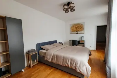 Un ou plusieurs lits dans un hébergement de l'établissement La Cure grand appartement familial 3 chambres avec terrasse et parking à 10 minutes de Colmar