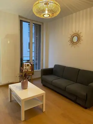 Coin salon dans l'établissement Mulhouse hyper centre - Grand T3- Aux bons enfants